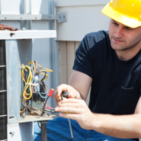HVAC Technician Repairing an Outdoor AC Unit